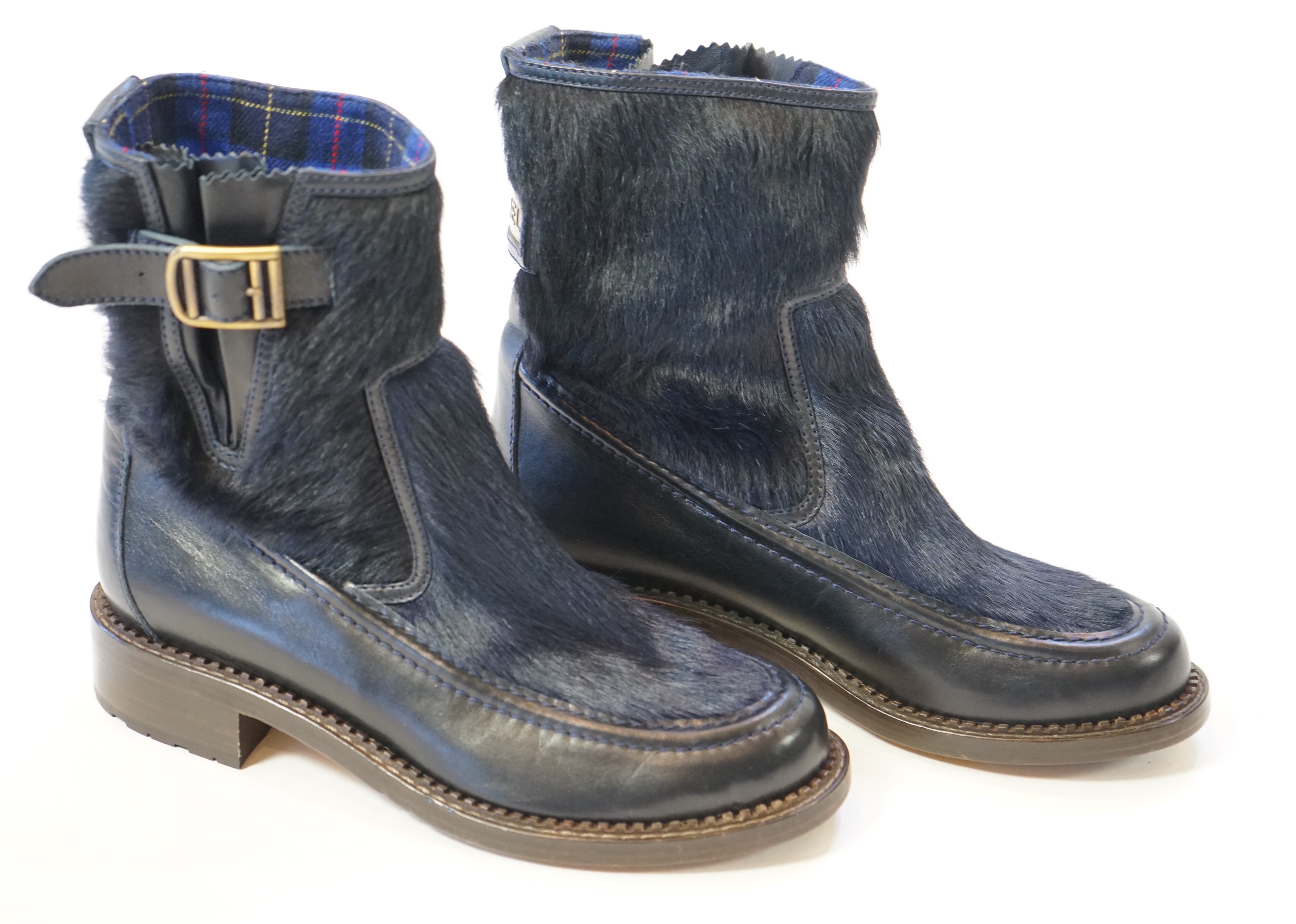 A pair of Chanel lady's navy blue leather calf hair pleated belted buckle boots, size EU 40.5